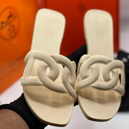 HERMES ALOHA MULES CARAMEL INTERLOCKING RUBBER FLATS