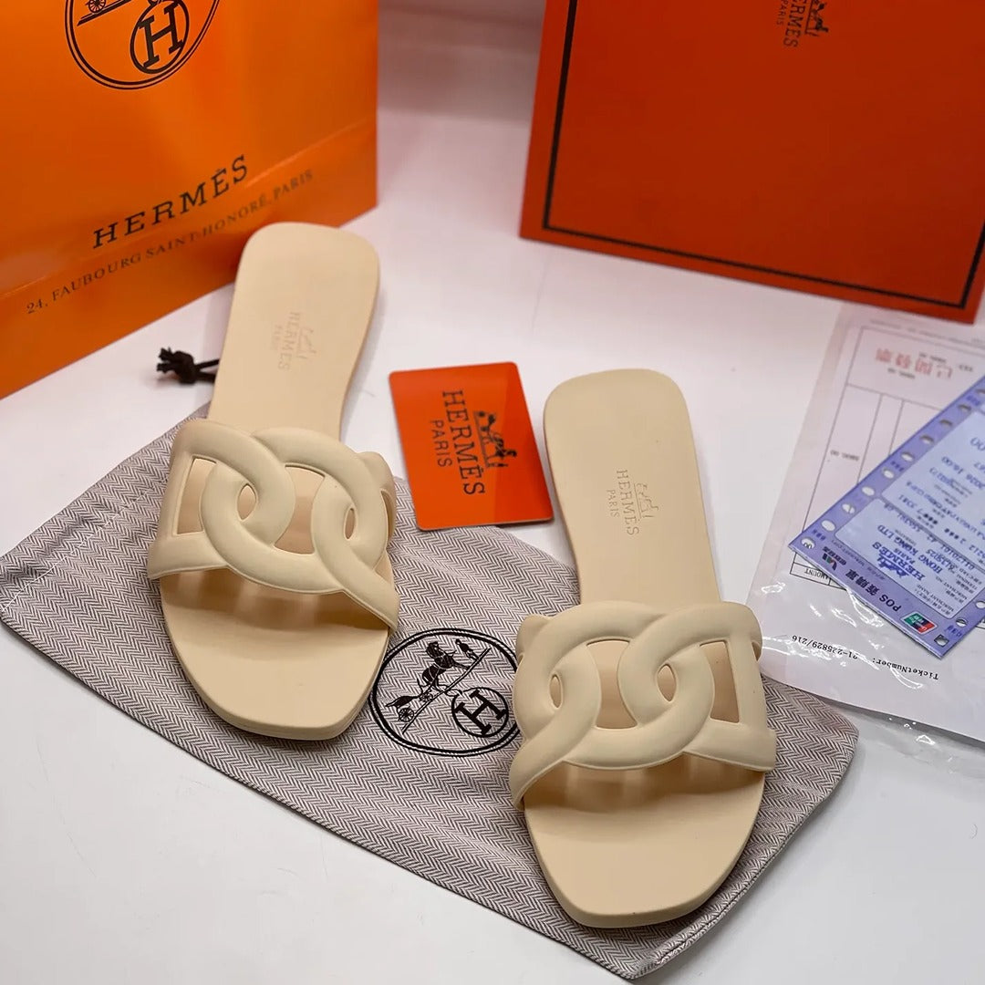 HERMES ALOHA MULES CARAMEL INTERLOCKING RUBBER FLATS