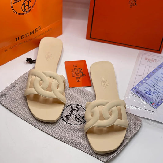 HERMES ALOHA MULES CARAMEL INTERLOCKING RUBBER FLATS