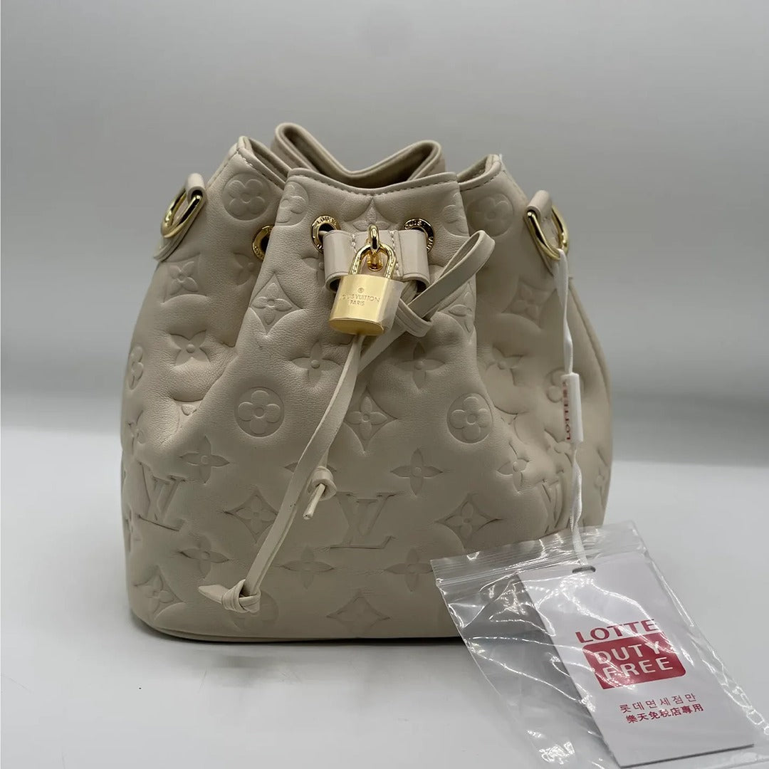 LOUIS VUITTON COUSSIN MONOGRAM EMBOSSED BUCKET BAG