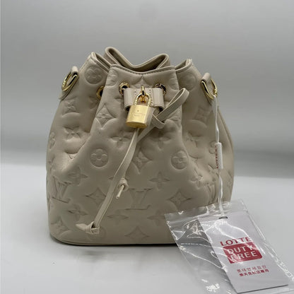 LOUIS VUITTON COUSSIN MONOGRAM EMBOSSED BUCKET BAG