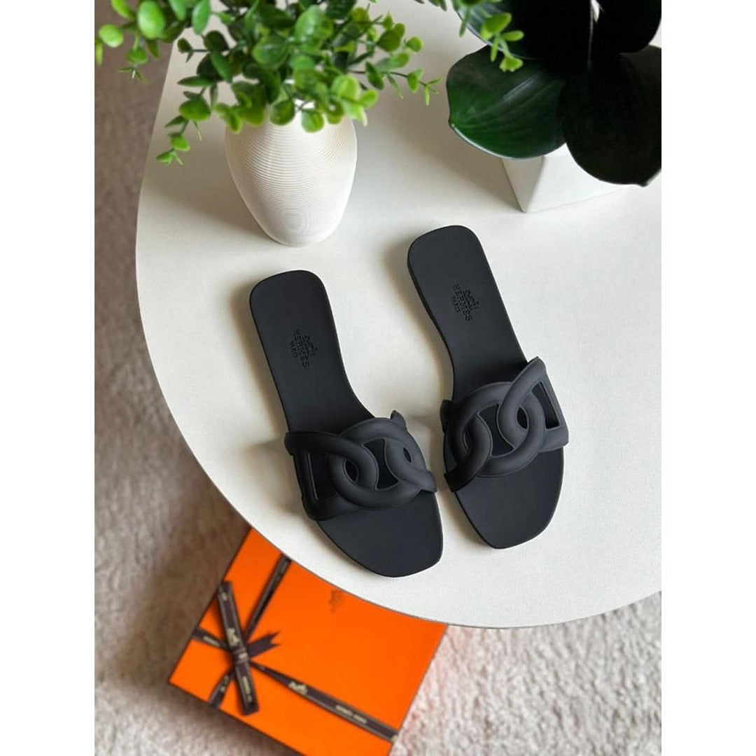 HERMES ALOHA MULES BLACK INTERLOCKING RUBBER FLATS