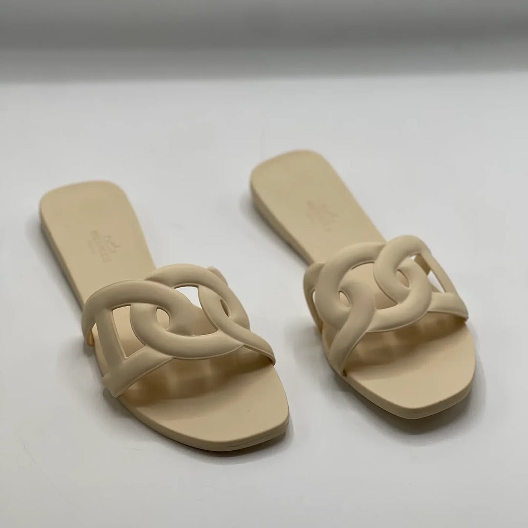 HERMES ALOHA MULES CARAMEL INTERLOCKING RUBBER FLATS