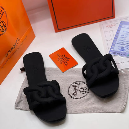 HERMES ALOHA MULES BLACK INTERLOCKING RUBBER FLATS