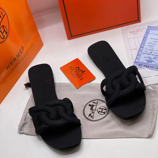 HERMES ALOHA MULES BLACK INTERLOCKING RUBBER FLATS