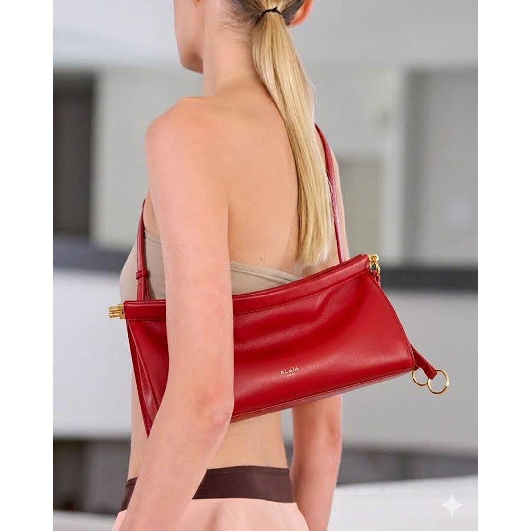 ALAÏA NOIR LE CLICK EAST WEST MEDIUM CURVE BAG